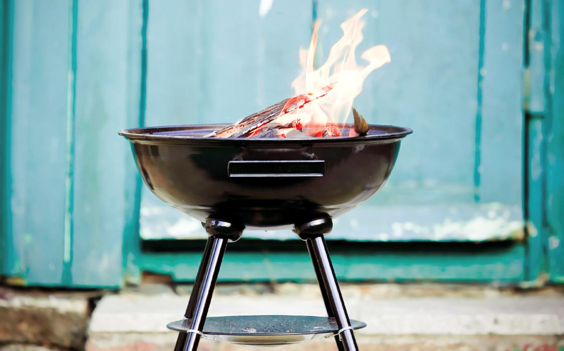 barbecue grill with flaming charcoal